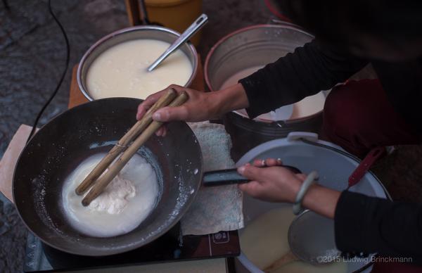 Mixing milk with sour milk as curdling agent.